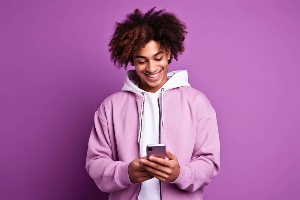 African American teenage sweatshirt holding purple