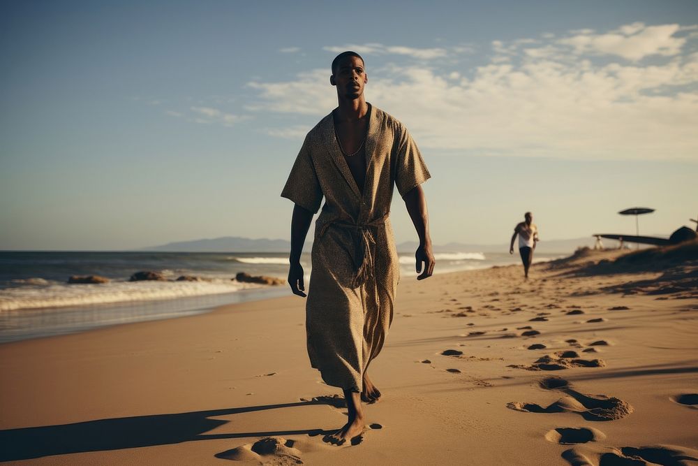 Black South African man walking outdoors beach. AI generated Image by rawpixel.
