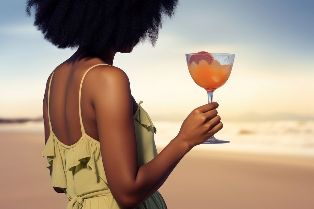 South African woman glass cocktail outdoors. AI generated Image by rawpixel.