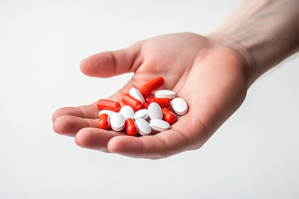 Hand holding pills medication medicine narcotic. AI generated Image by rawpixel.