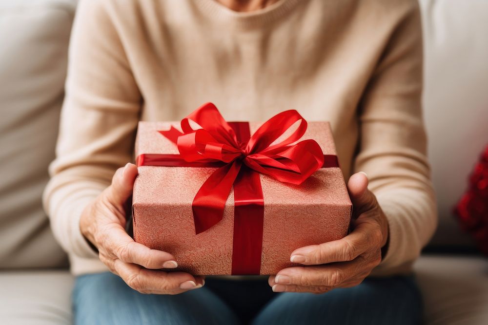 Senior woman gift box anticipation. AI generated Image by rawpixel.