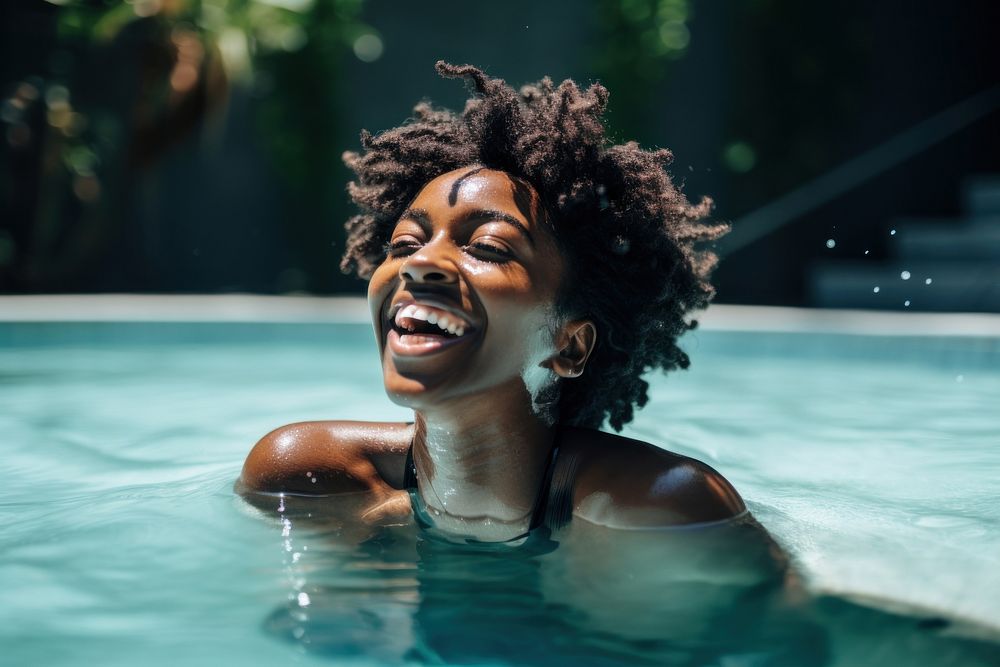 Black woman swimming in a pool laughing smiling bathing. AI generated Image by rawpixel.