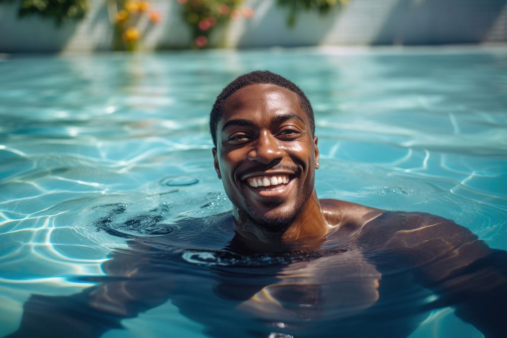 Black man swimming in a pool smiling sports summer. AI generated Image by rawpixel.