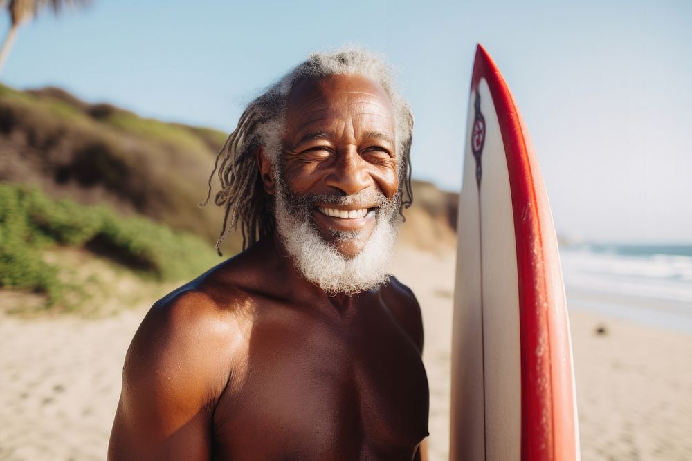 Old black man surfing outdoors smiling. AI generated Image by rawpixel.