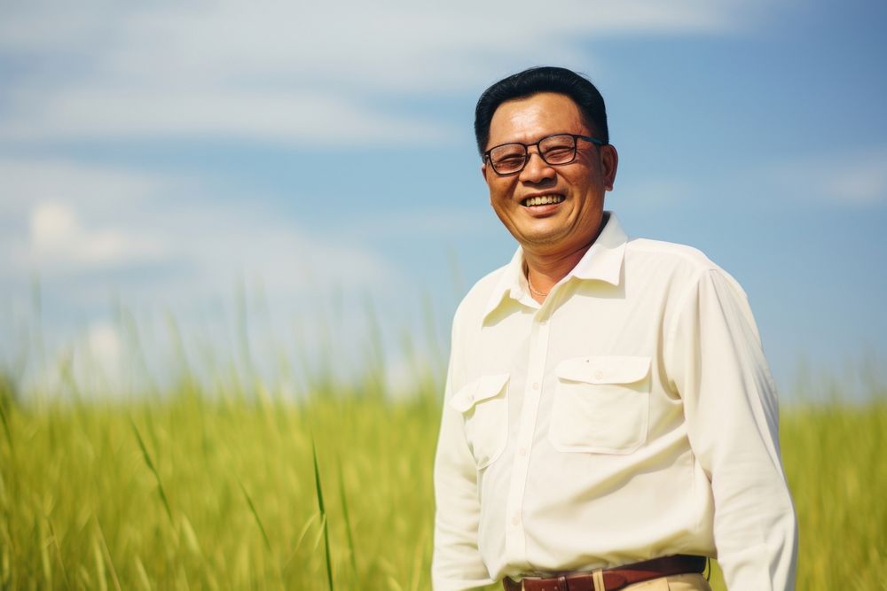 East asian man portrait grass photography. AI generated Image by rawpixel.