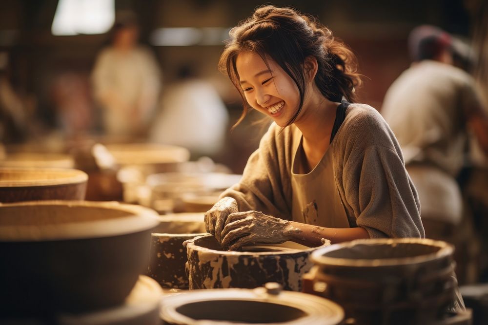 Japanese girl working ceramic looking happy and fun pottery adult craftsperson. AI generated Image by rawpixel.