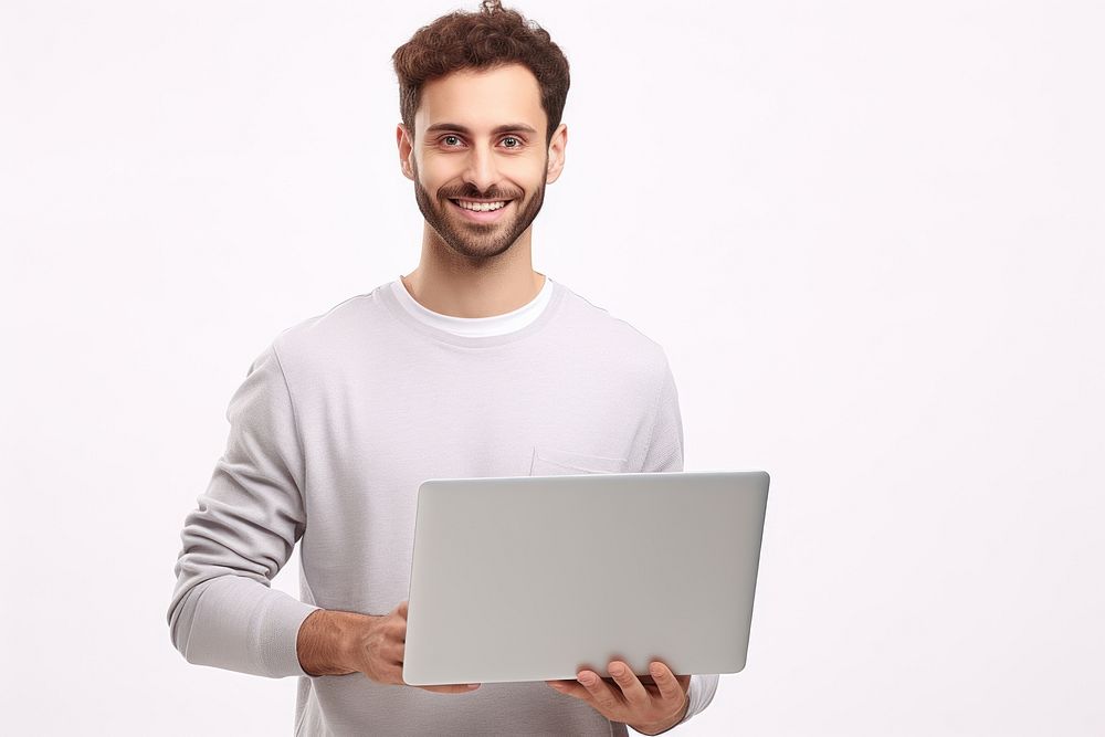Young man holding a laptop standing computer portrait. AI generated Image by rawpixel.