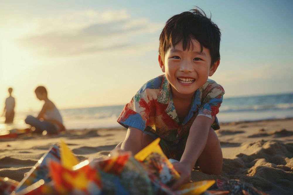 East asian boy playing summer beach portrait. AI generated Image by rawpixel.