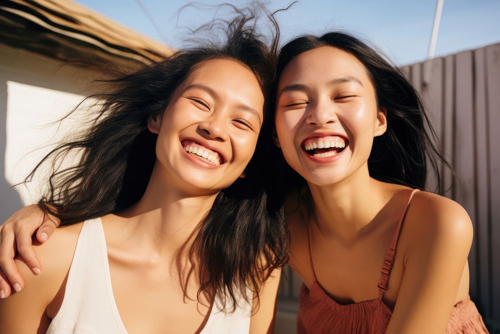 East asian female couple laughing summer smile. AI generated Image by rawpixel.
