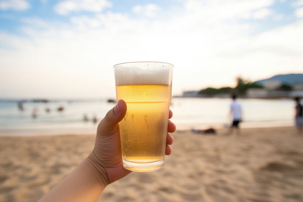 Japanese man holding beer beach outdoors summer. AI generated Image by rawpixel.
