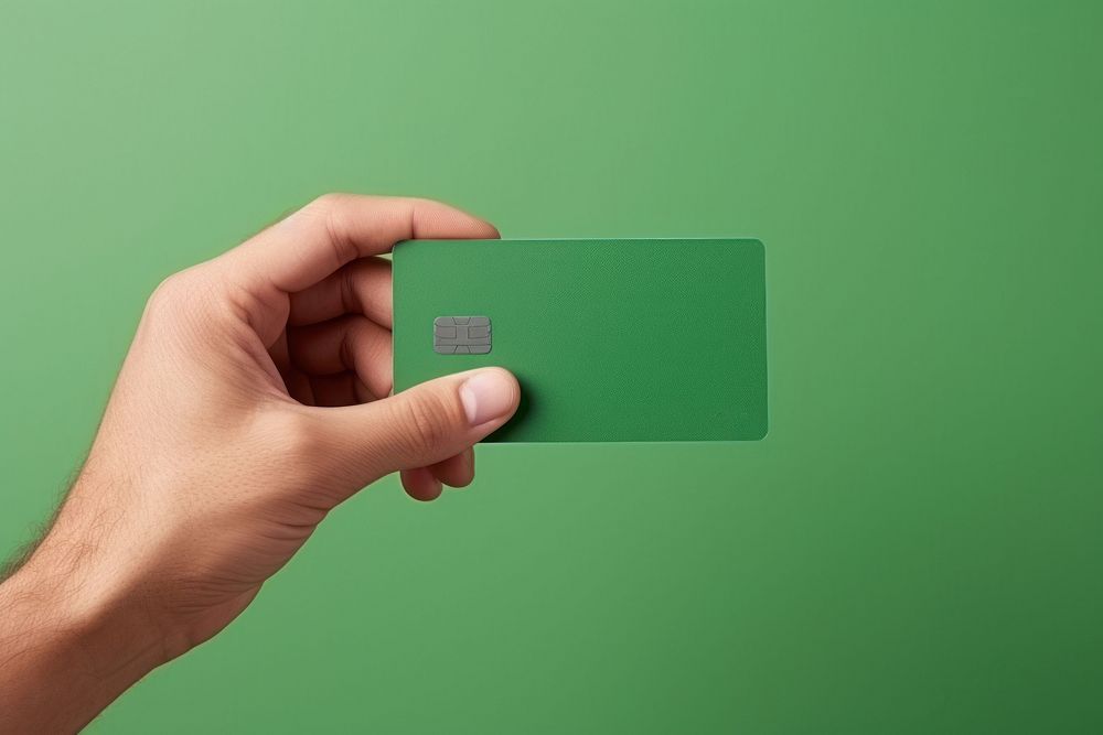 Credit card green hand green background. AI generated Image by rawpixel.