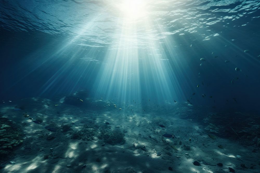 Calm underwater scene with sunrays reaching the seabed outdoors nature tranquility. AI generated Image by rawpixel.