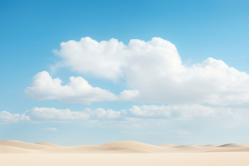 White clouds on blue sky over sand dunes in the desert outdoors horizon nature. AI generated Image by rawpixel.