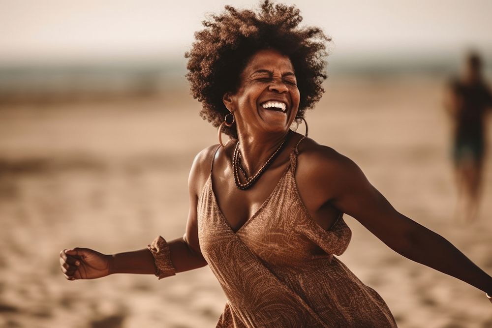 African American women laughing dancing beach. AI generated Image by rawpixel.