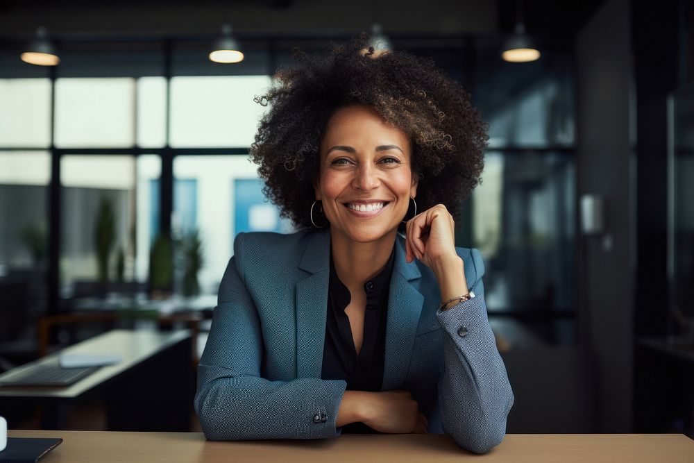 Mature cheerful african american executive businesswoman at workspace smile adult happy. AI generated Image by rawpixel.