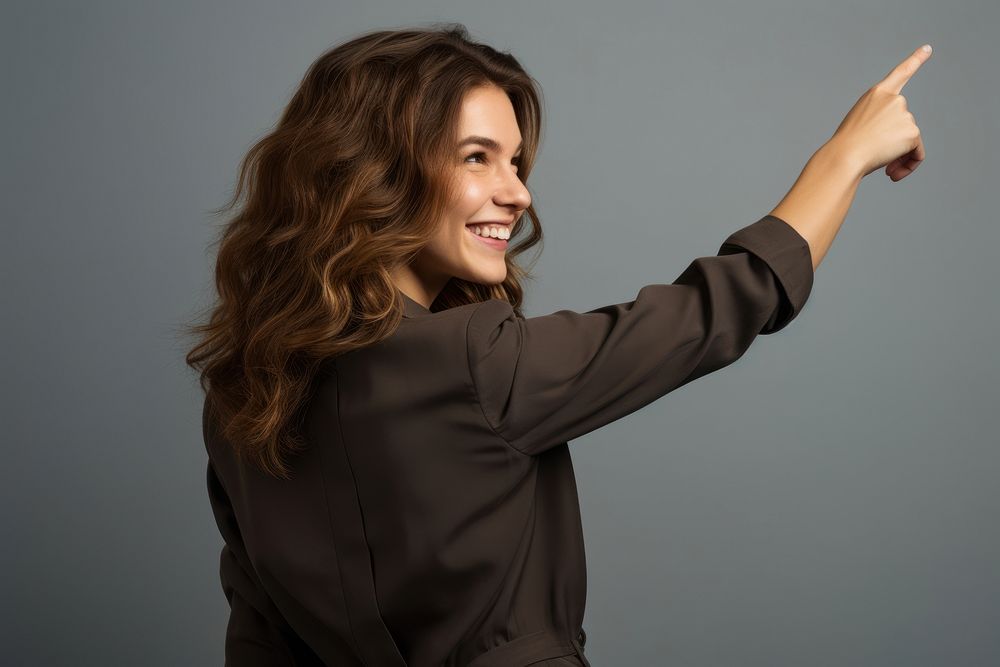 Woman with brown hair pointing portrait looking. AI generated Image by rawpixel.
