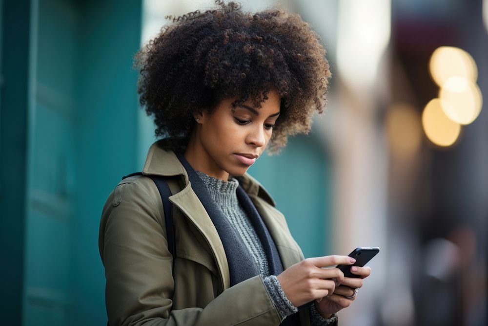 African American woman looking adult phone. AI generated Image by rawpixel.