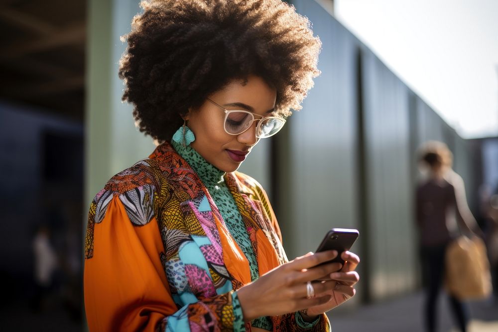 African American woman looking adult phone. AI generated Image by rawpixel.