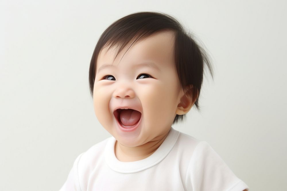 Cute baby asian laughing innocence happiness cheerful. AI generated Image by rawpixel.