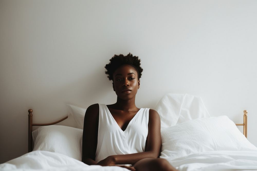 African woman bed furniture sitting. AI generated Image by rawpixel.