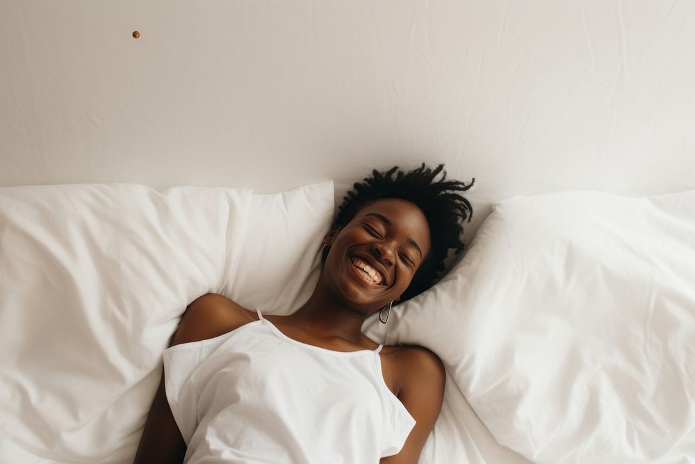 African woman bed furniture smiling. AI generated Image by rawpixel.