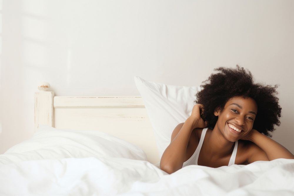 African woman smiling resting bedroom. AI generated Image by rawpixel.