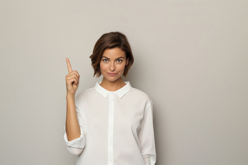 Woman pointing portrait blouse. AI generated Image by rawpixel.