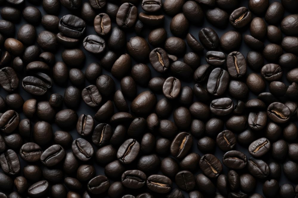 Black coffee bean backgrounds coffee beans abundance. AI generated Image by rawpixel.