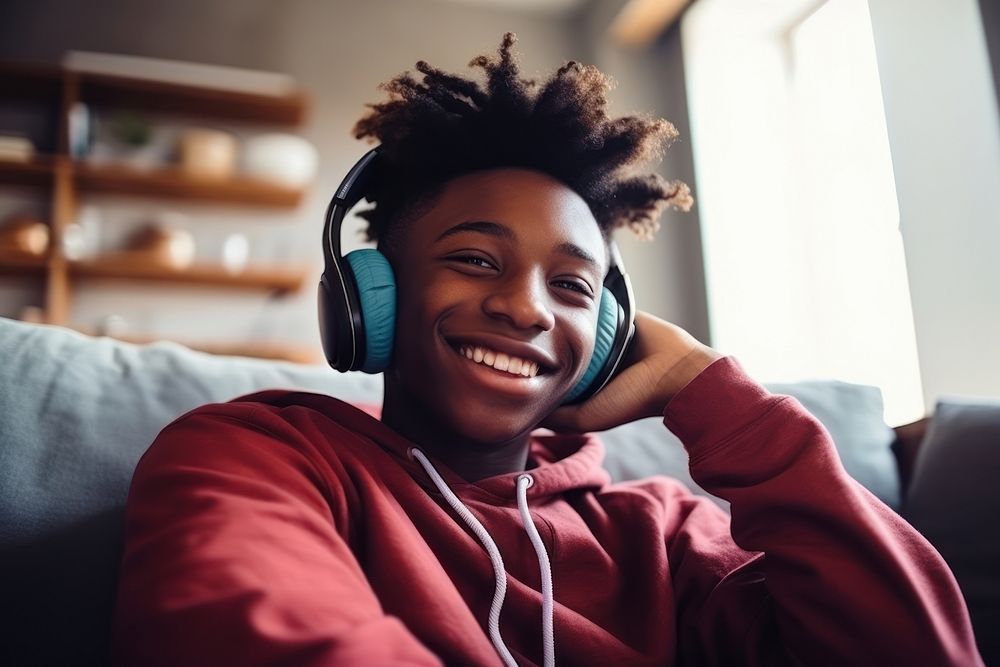 Black man teenager headphones headset electronics. AI generated Image by rawpixel.