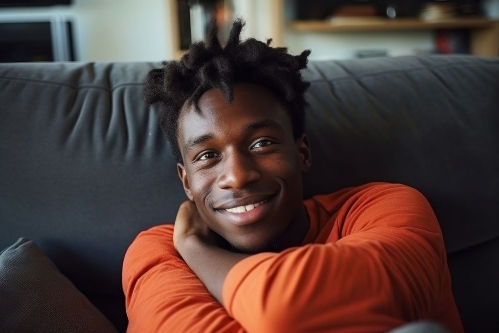 Black man teenager furniture portrait smile. AI generated Image by rawpixel.