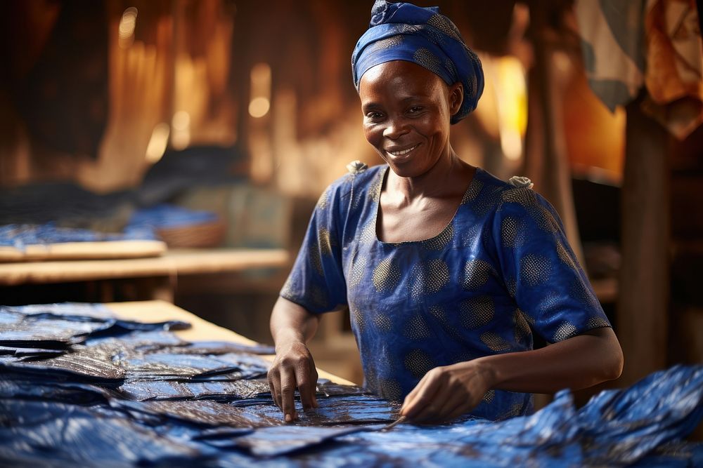 Making Adire fabric craftsperson blacksmith happiness. AI generated Image by rawpixel.