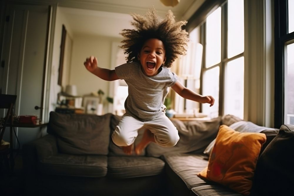Black man child shouting living room excitement. AI generated Image by rawpixel.