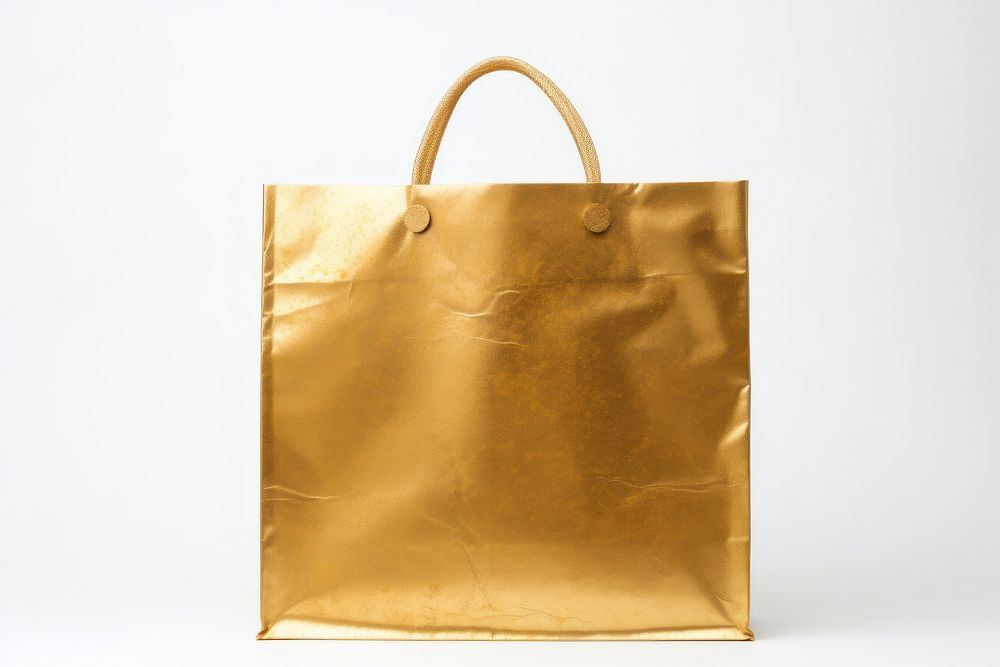 Shopping bag handbag gold accessories. AI generated Image by rawpixel.