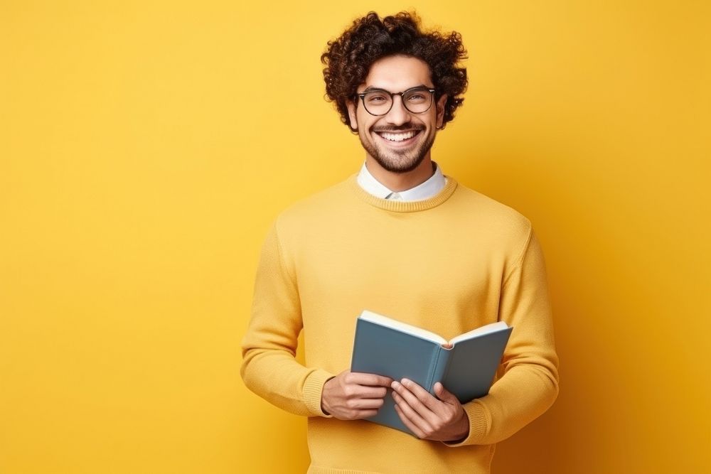 A smile student adult men holding book portrait glasses intelligence. AI generated Image by rawpixel.