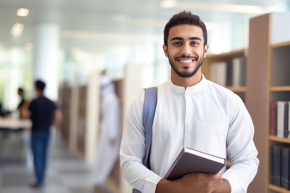 A smile student arab men holding book portrait adult entrepreneur. 