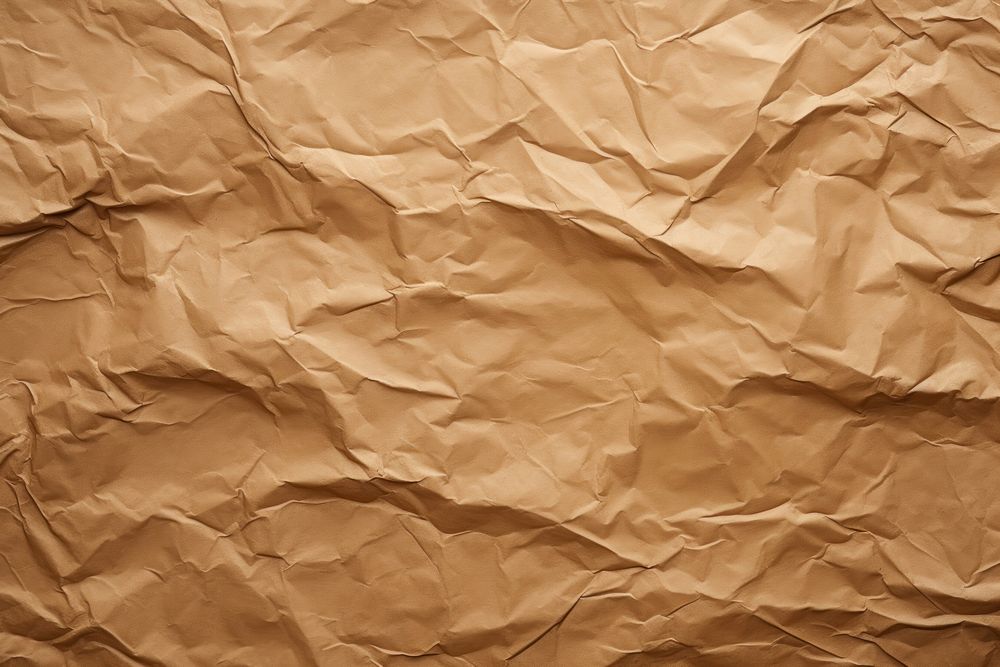 Brown paper crumped texture backgrounds parchment cardboard. AI generated Image by rawpixel.