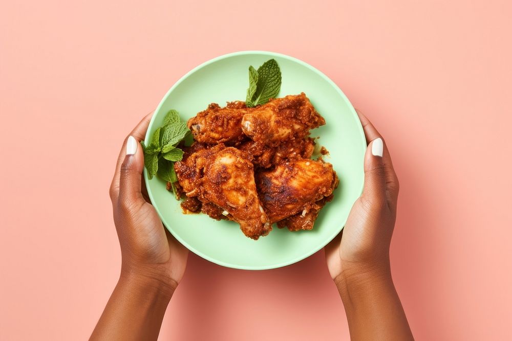 BBQ dish fritters holding plate. AI generated Image by rawpixel.