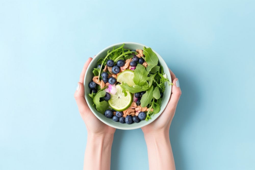 Blueberry salad dish blueberry holding fruit. AI generated Image by rawpixel.