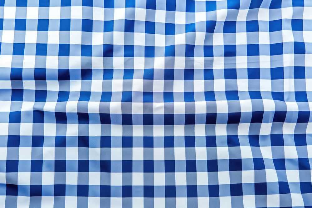 Blue and white checker backgrounds tablecloth repetition.