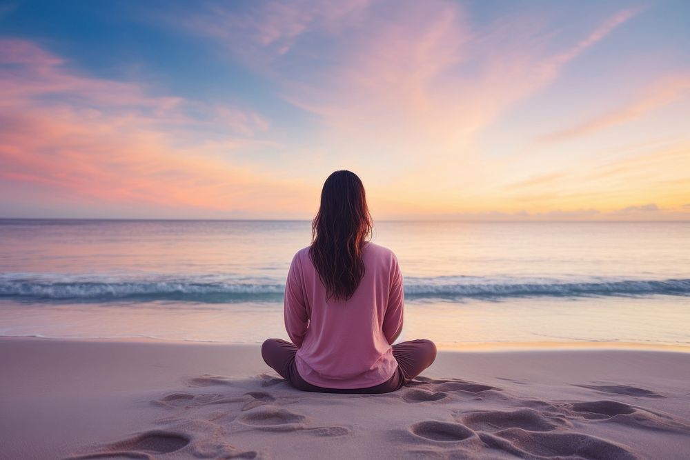 Woman meditating on the beach sky outdoors horizon. AI generated Image by rawpixel.