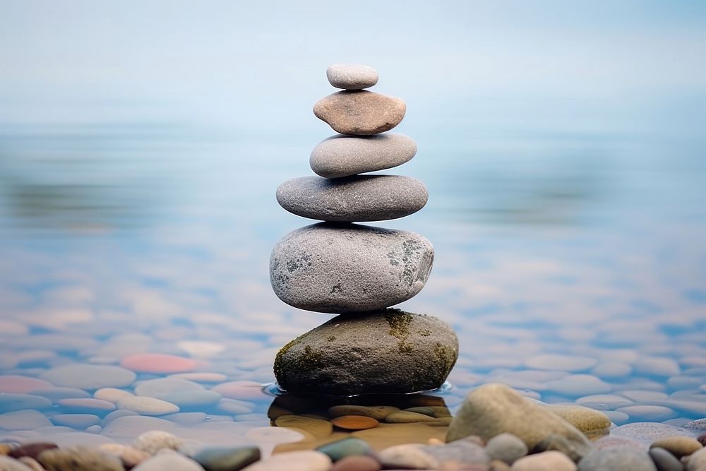 Balanced stone pebble sea tranquility. AI generated Image by rawpixel.