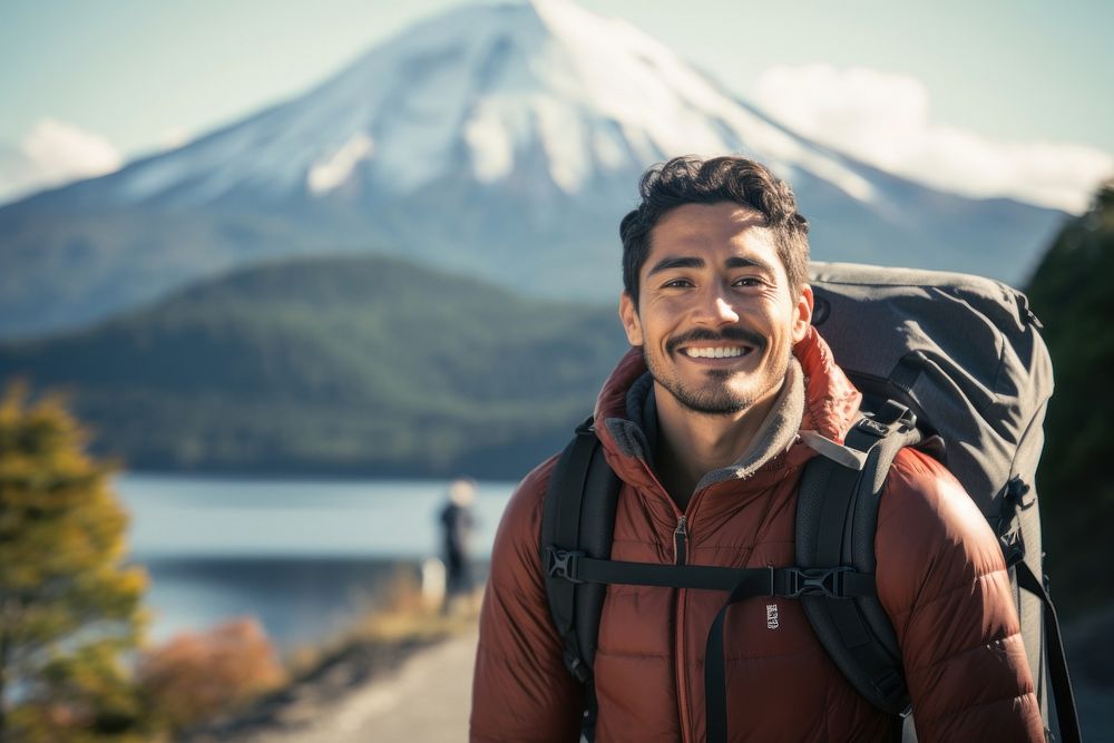 Smiling Latino man with backpack photography adventure mountain. AI generated Image by rawpixel.