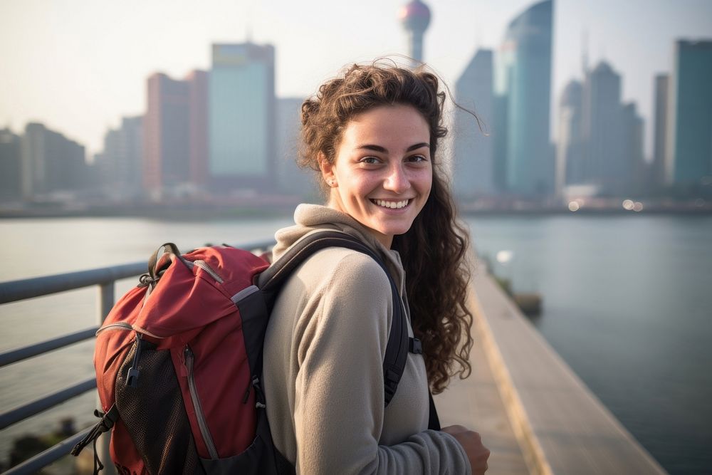 Smiling Latino women with backpack architecture photography cityscape. AI generated Image by rawpixel.