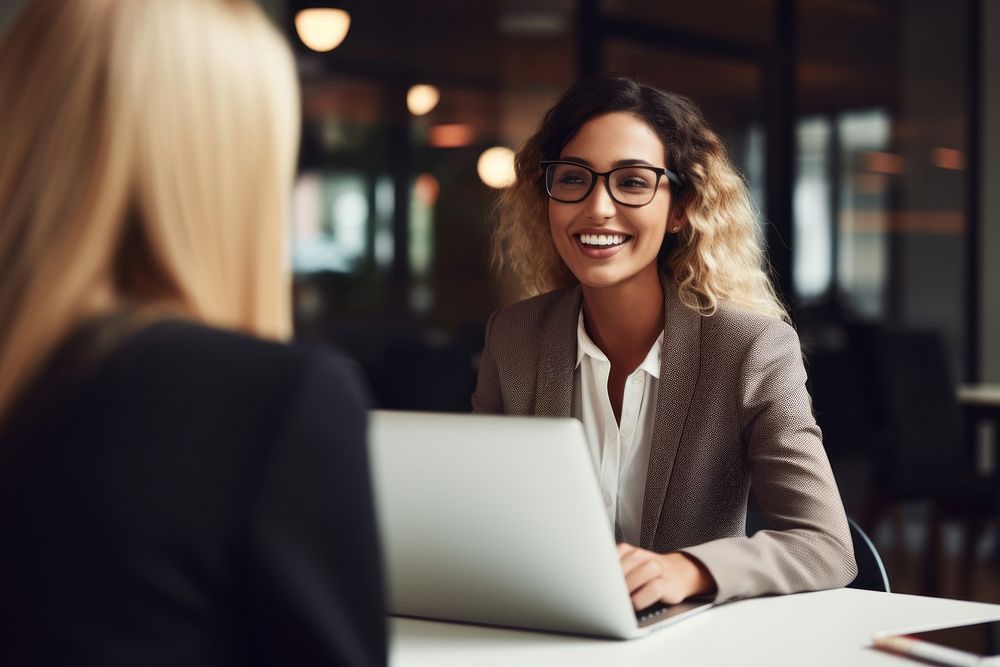 Two women sitting and talking conversation computer glasses. AI generated Image by rawpixel.