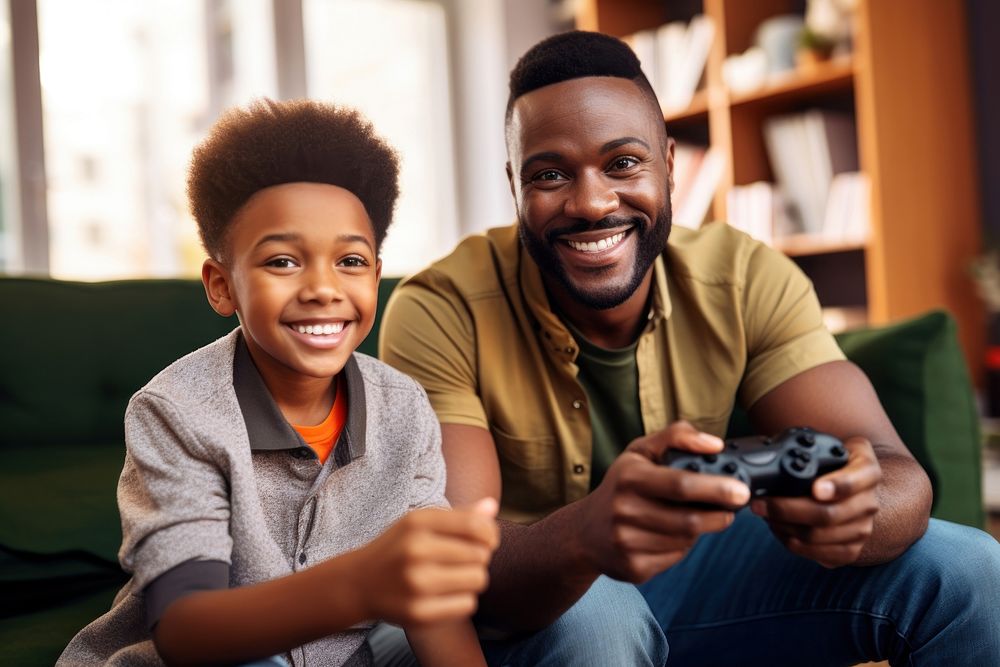 African American father and son enjoy playing games together adult child happy. AI generated Image by rawpixel.