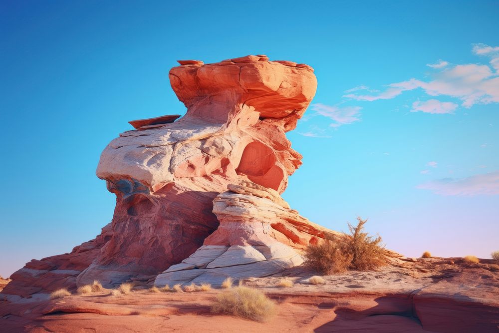 Rock formation on a desert cliff nature outdoors tranquility. AI generated Image by rawpixel.