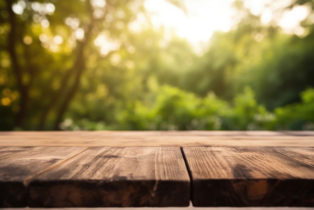 Wooden board with unfocused nature background wood backgrounds hardwood. AI generated Image by rawpixel.