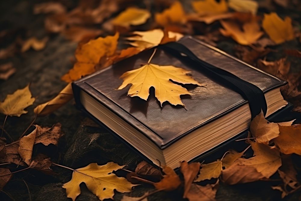 Autumn book publication leaves. AI generated Image by rawpixel.
