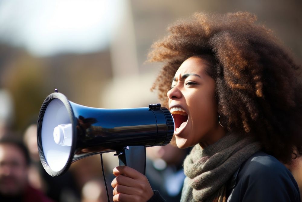 Black woman use megaphone in public shouting adult architecture. AI generated Image by rawpixel.