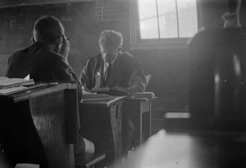 [Boy and teacher in classroom] (1920s to 1930s) by Roland Searle.
